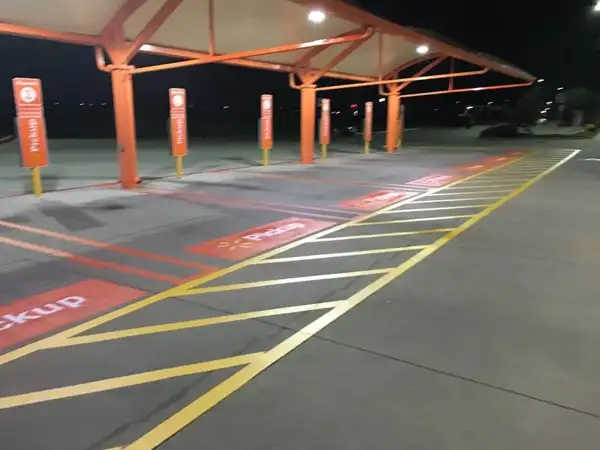 Crew preparing pavement surface